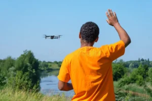 Young man flying drone