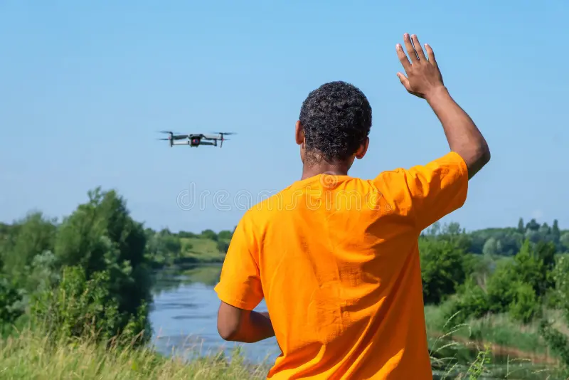 Young man flying drone